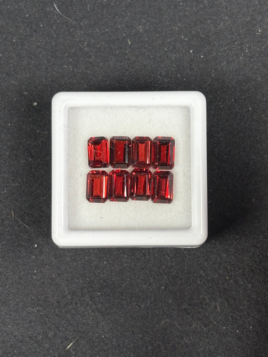 6.26ctw red garnet lot from Mozambique, 8 emerald-cut stones, 6x4 mm