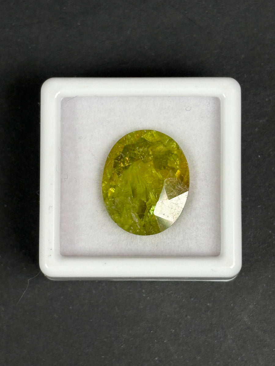 10.9ct Greenish Yellow Sphene Oval, 15.4 x 12.7 x 7.2mm · GEM-6054