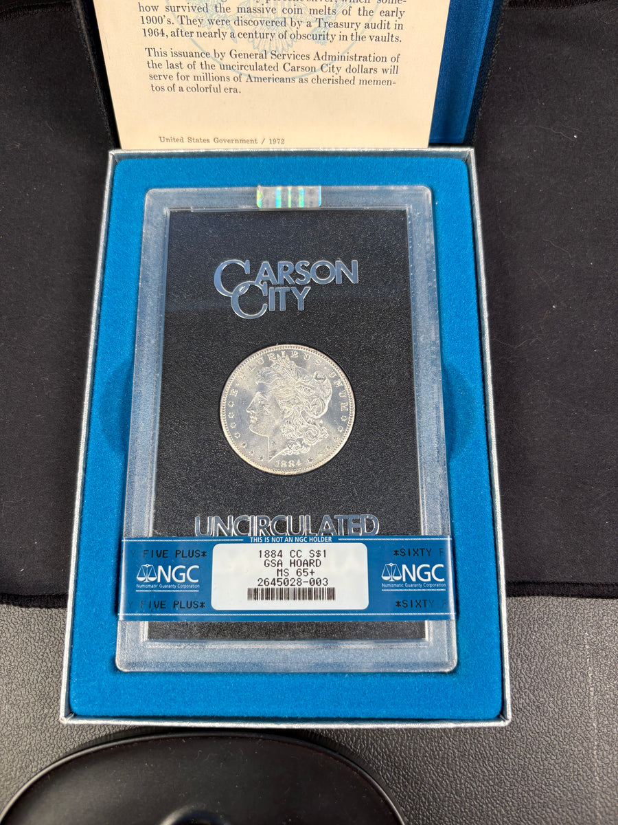1884-CC Morgan Dollar GSA NGC MS65 Box & Papers