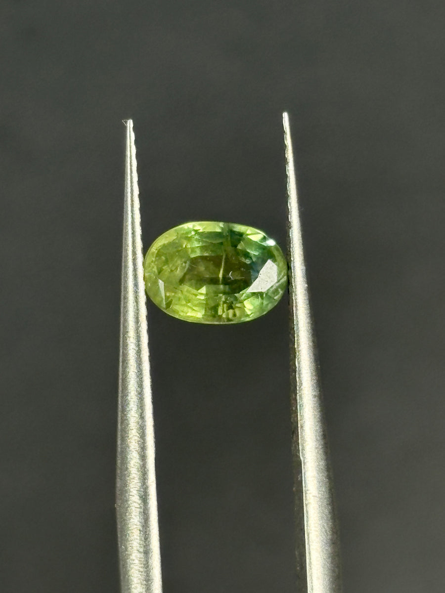 1.17ct heated green Australian sapphire, oval cut, 7x5x3.35 mm