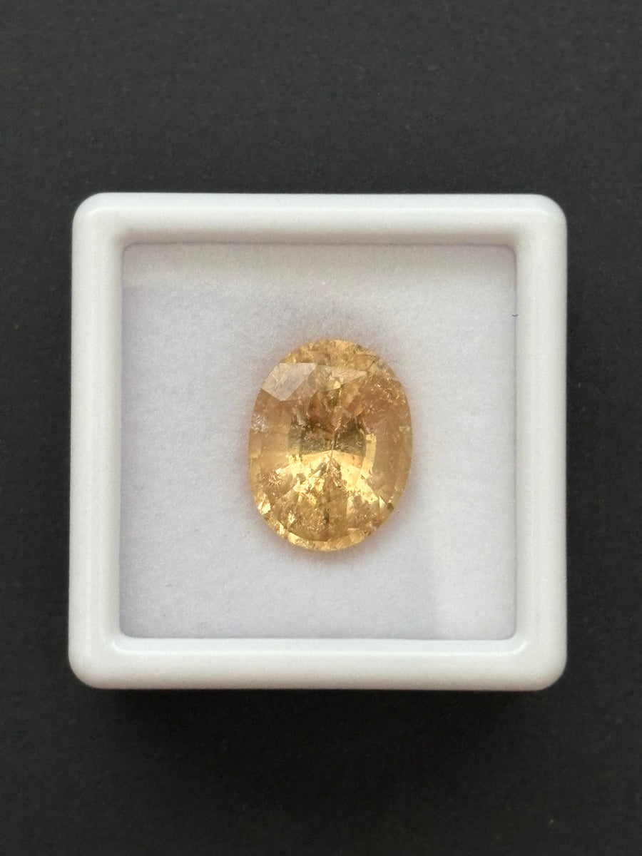 6.3ct yellow grossular garnet, oval cut, 12.5x9.5x7.77 mm