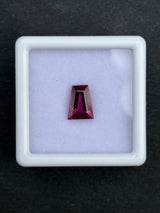 1.42ct pinkish purple rhodolite garnet from Tanzania, trapezoid cut, 7.5x6x3.5 mm
